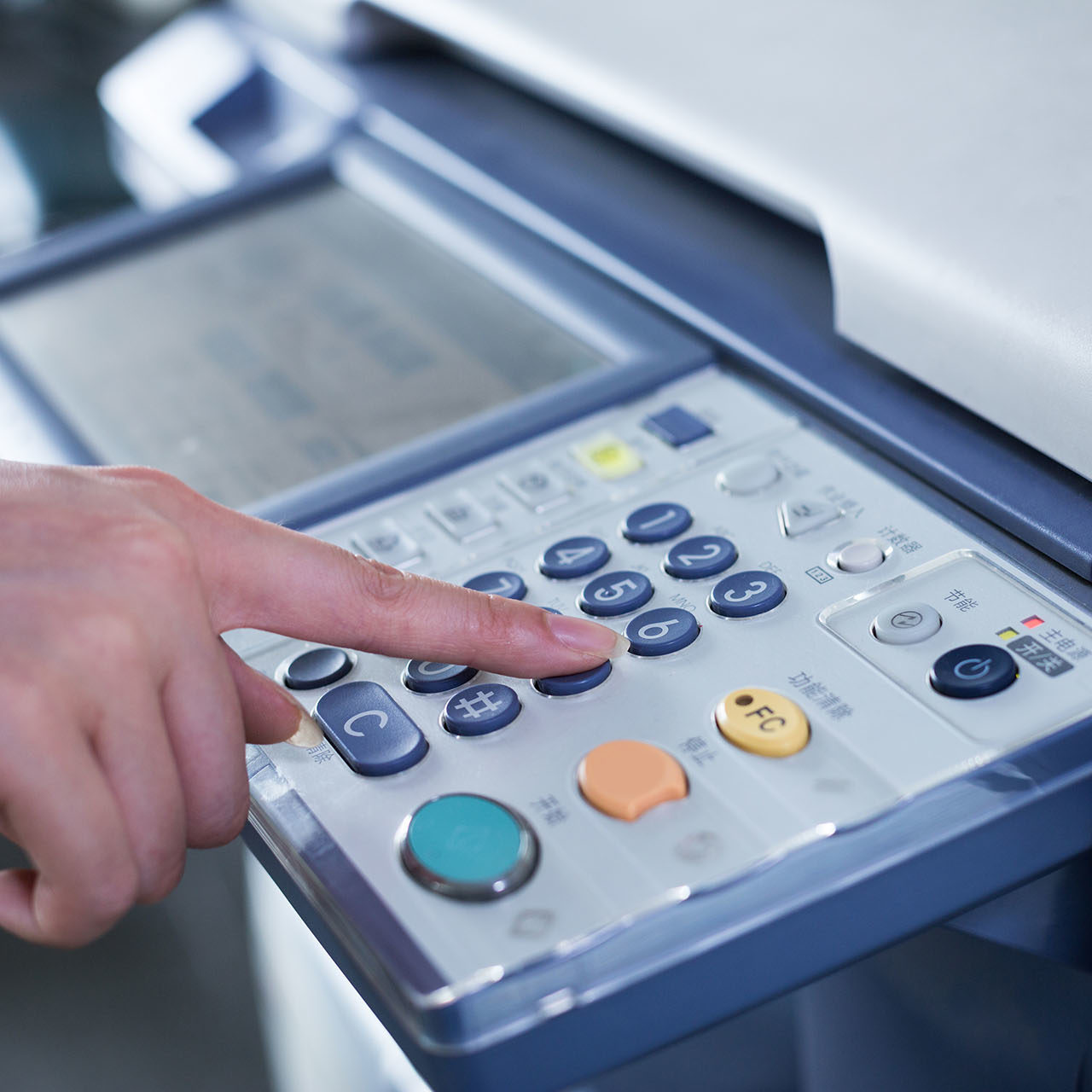 hand press button on panel of printer
